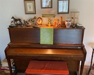 Baldwin piano covered in Great Dane things and sundry other delights.