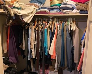 Closet full of women's clothes, shoes, purses, belts, etc.