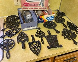 Cool antique iron trivet collection.