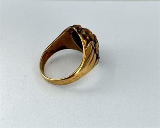 10K yellow gold with man head shape ring with rubies in the eyes and mouth. 8.10 gr --- $325.-