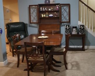 Mahogany dining table, mahogany secretary, green leather recliner