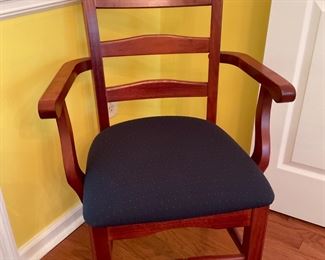 These chairs were purchased in Australia to accompany the red gum table. They were not made by the Frasers. There are two arm chairs and four straight chairs with seats upholstered  in a neutral blue fabric!