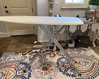 Super sturdy /great quality ironing board. With folding shelf and iron holder. 