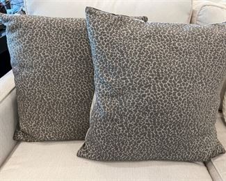 Two gray leopard, printed feather filled pillows
