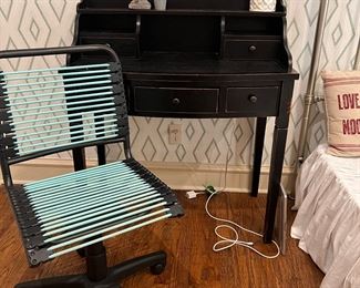 Black desk and Container Store bungee cord desk chair. 