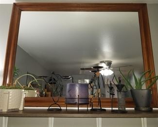 plants, candles and candle holders, large wood frame mirror