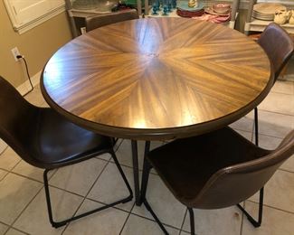 Wood, iron and leather table and four chairs