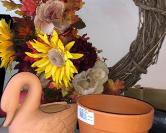 Reeds and terra-cotta statuary and pots