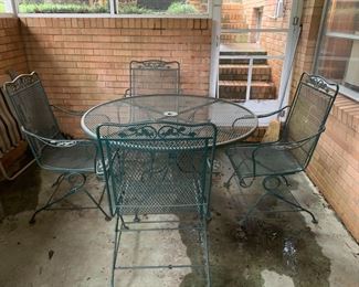 #69 Green Wrought iron Table w/4 bouncy Chairs - 48round x 28 $125.00