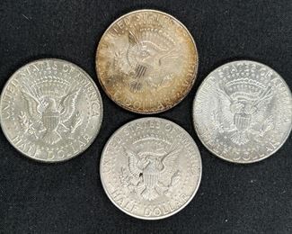 Four 1964 Kennedy Half Dollars