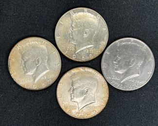 Four 1964 Kennedy Half Dollars