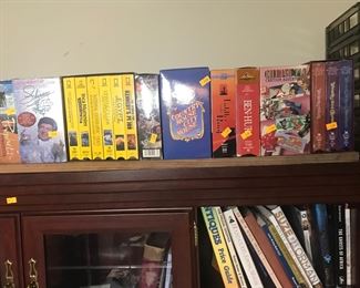 VHS movie tapes. A large collection is available, many in their original wrapping.