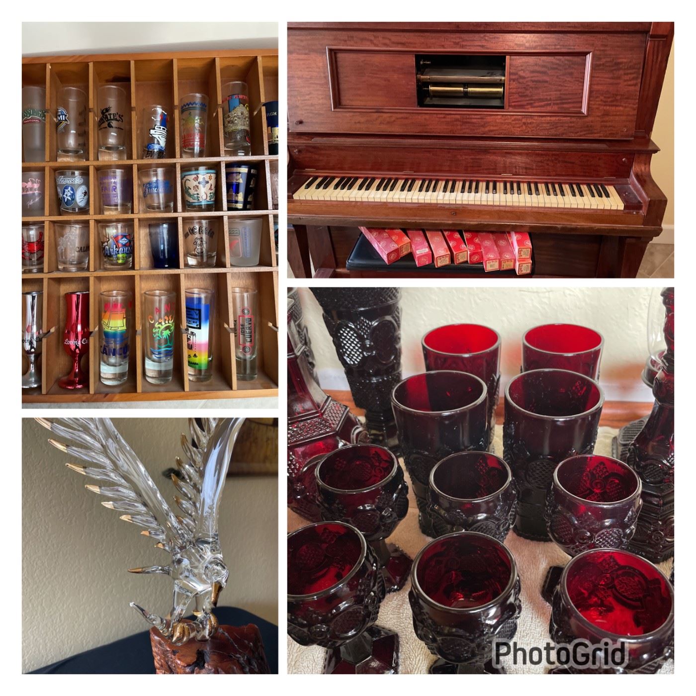 Red colored glass, handblown eagle statue, variety of shot glasses and  a player piano.