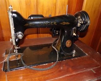 Singer electric sewing machine in cabinet