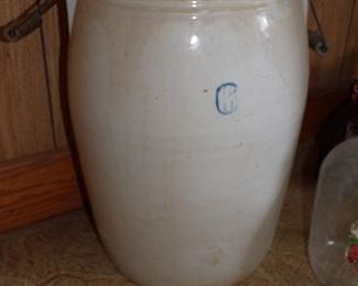 Six gallon stoneware churn jar. Has its dasher
