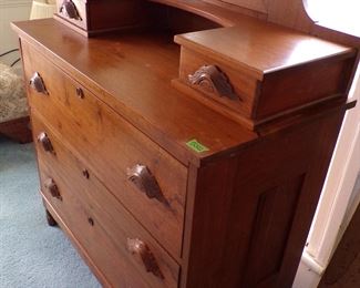 Handmade walnut dresser with glove boxes and mirror. Note the ornate pulls on all drawers. Another piece made on the farm.