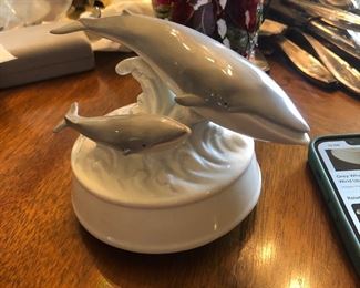 Dolphin music box.  It plays “Tiny Bubbles”