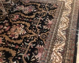 Stunning high dollar rug.  In 1963 the homeowners paid $5300.  The son cannot remember a time when people walked on it with shoes.  The rug is in superb condition. $1400.