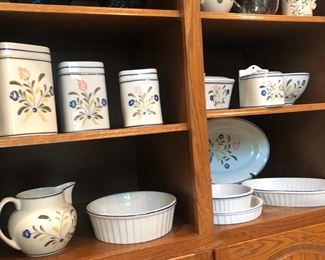 Set of hand painted serving pieces and canisters made in Poland.