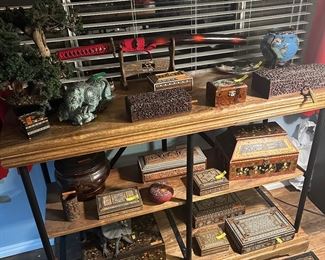  3 shelf buffet table displaying realistic jade tree and Asian art items
