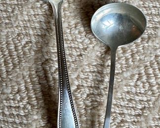 Item 158: Frank Smith Sterling Silver Gravy Spoon (left): $75 Item 159: Sterling Silver Sauce Spoon (right): $20