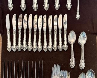 Item 8: Reed & Barton Sterling Flatware Set (100.5 toz.): $2695 (12 dinner forks, 12 knives, 6 tablespoons, 24 teaspoons, 6 soup spoons, 12 butter knives, 2 serving forks, pie server, gravy ladle, jelly spoon, slotted spoon, serving spoon)