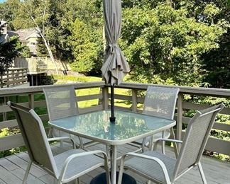 Item 186: Patio Table, Umbrella & (4) Armchairs: $325