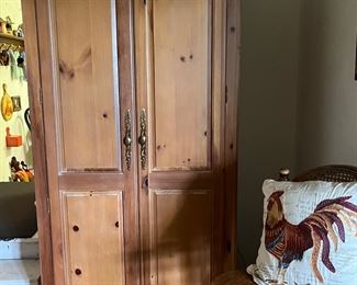 Pine armoire, oak bar stool, rooster pillow