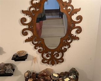 Mirror, shelves, rock collection. 