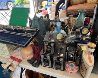 Silver clarinet, collector liquor bottles, box cameras, dolls &head
