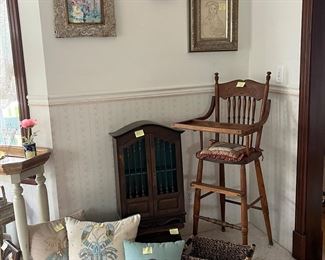 Wooden high chair, pillows, art work