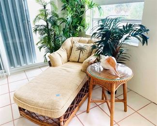 rattan and bamboo lounger and side table, decorative shells, silk