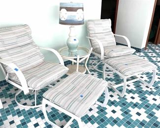 multiple sets of outdoor furniture including cushions