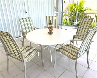 outdoor table striped chairs