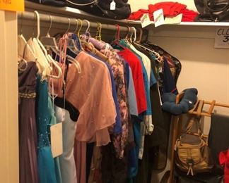 closet full of clothes and purses