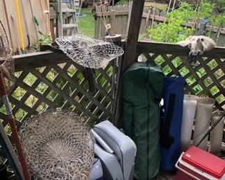 The backyard gazebo is LOADED with fishing rods & reels, lures & tackle, fishing supplies, outdoor items and more!