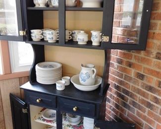 Cupboard full of Yorktowne Dishes