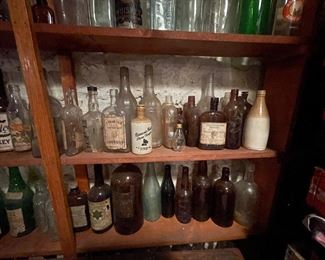Hundred of vintage and antique whiskey bottles (not all pictured here)