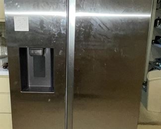 Side by side refrigerator, no more than 2 years old.