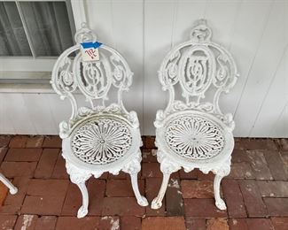 TWO CAST IRON CHAIRS