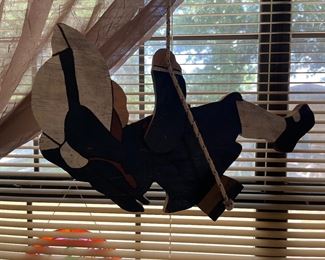 articulated wooden girl on swing