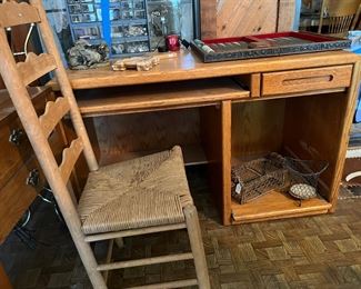 desk and ladder back chair with rush seat