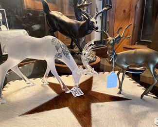deer buck figurines on  cowhide lone star placemat
