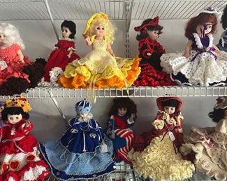 dozens of dolls with hand crocheted dresses