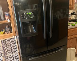 black side-by-side refrigerator with drawer freezer