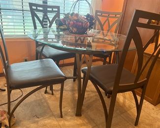 glass top dining table and four chairs