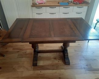 Solid wood dinner table - 35-3/4" x 35-3/4" & 29-1/4" tall. Extends out to 59-1/2".