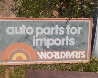 "Worldparts" imports auto parts sign