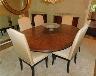 ADAC Ainsworth Noah Showroom Through C. Weaks Interiors.  60" Round Custom Dining Table With Bronze Star Marquetry With Leaf Arch And Curved Base  & 6 Custom Chairs 2 Leaves Was $15,000.00 