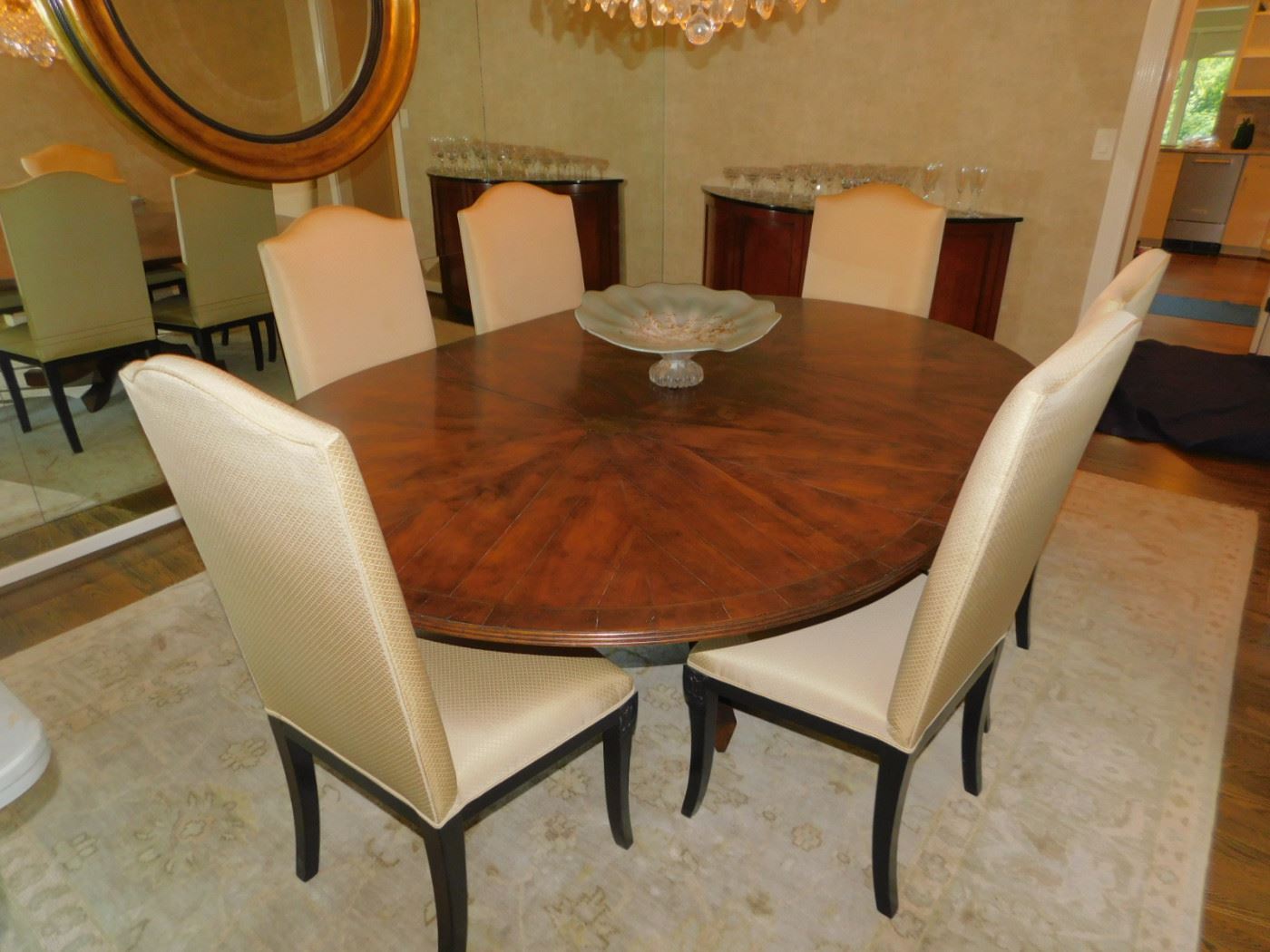 ADAC Ainsworth Noah Showroom Through C. Weaks Interiors.  60" Round Custom Dining Table With Bronze Star Marquetry With Leaf Arch And Curved Base  & 6 Custom Chairs 2 Leaves Was $15,000.00 
